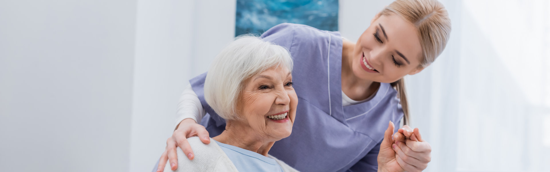 happy senior woman with caretaker