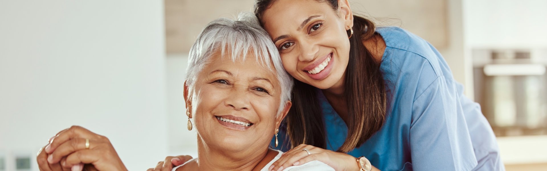 happy senior woman with caretaker